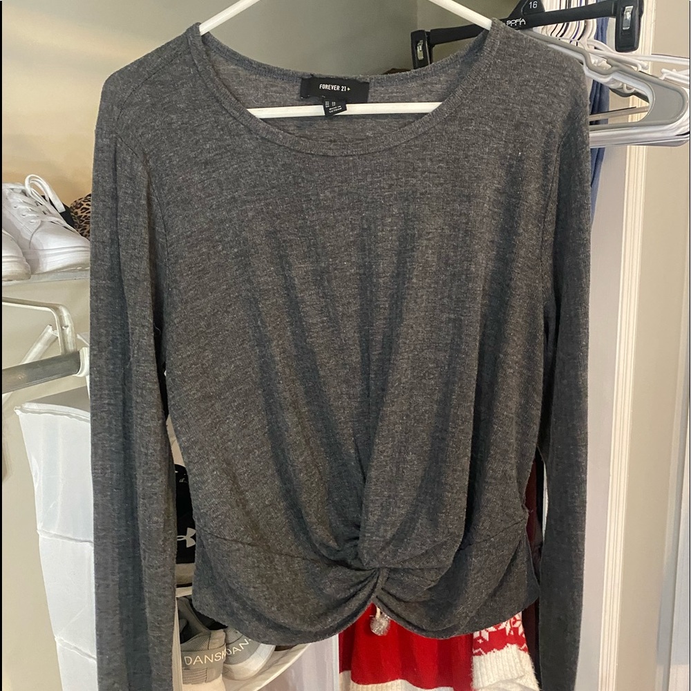 Long-sleeve gray shirt.